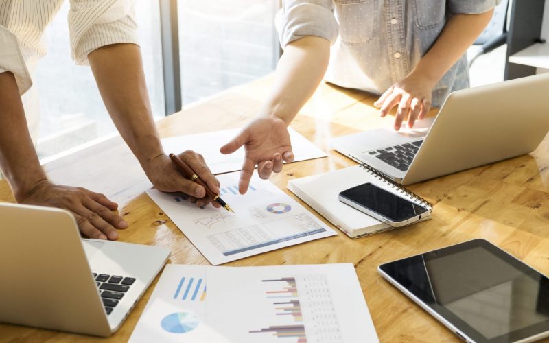 Business people meeting to discuss the graphs and numbers