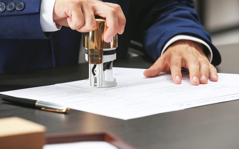 Notary public in office stamping document
