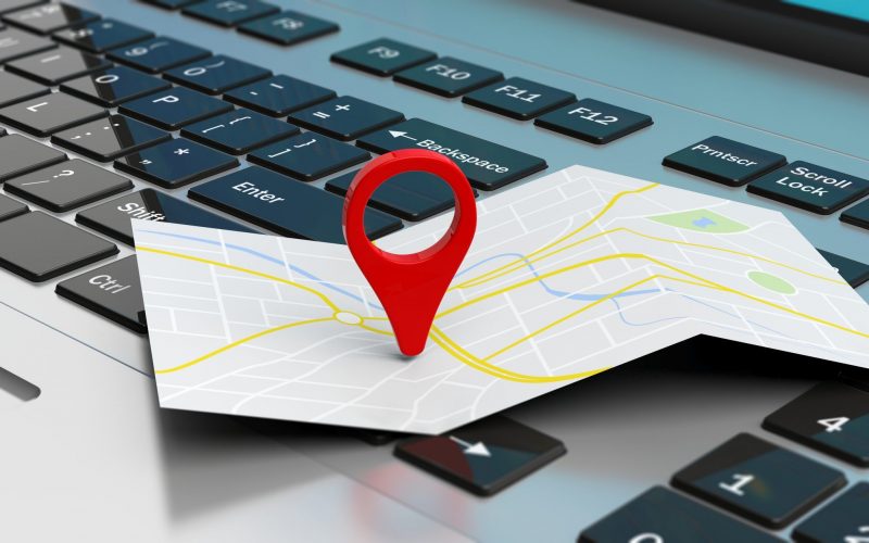 Travel and navigation concept - map pointer location on a laptop. 3d illustration