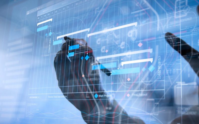 Project manager working and update tasks with milestones progress planning and Gantt chart scheduling virtual diagram.Businessman hand pressing an imaginary button on virtual screen