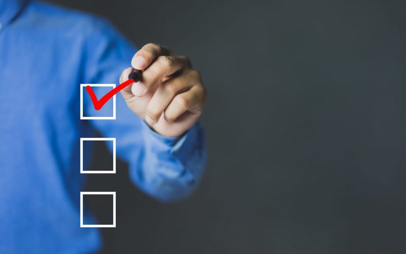 Checklist concept, Businessman checking mark on the check boxes with marker red, copy space