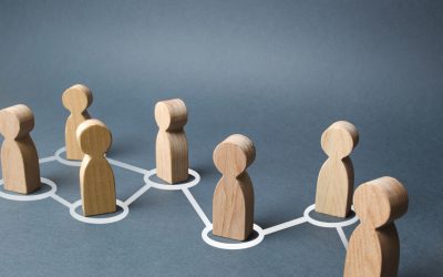 Chain of people figurines connected by white lines. Cooperation and interaction between people and employees. Dissemination of information in society, rumors. Communication. social contacts